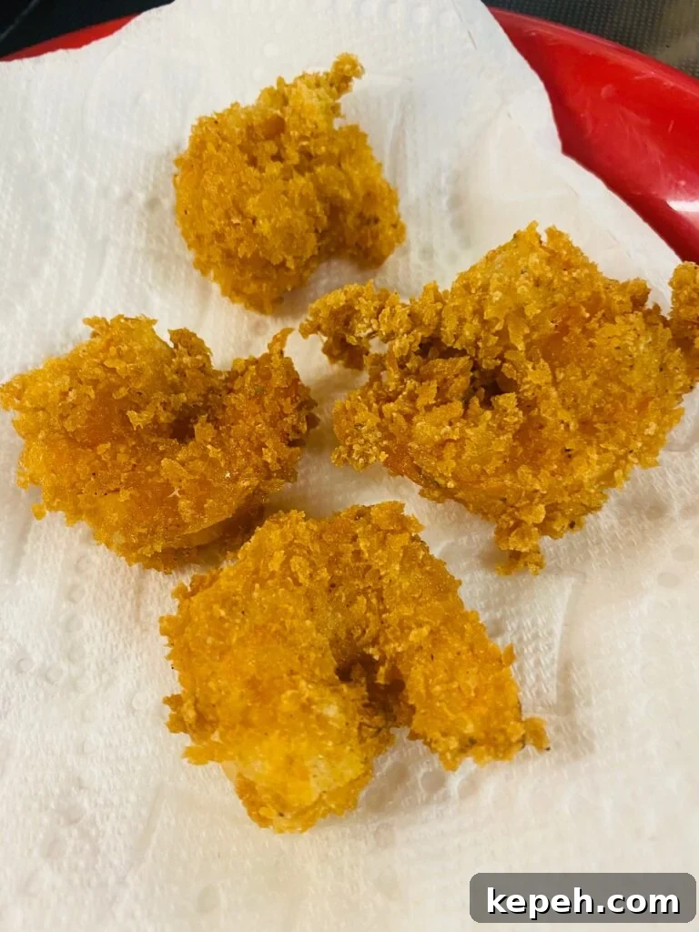 Crispy Old Bay Fried Shrimp Recipe 5 Fried old Bay shrimp on paper towels after cooking