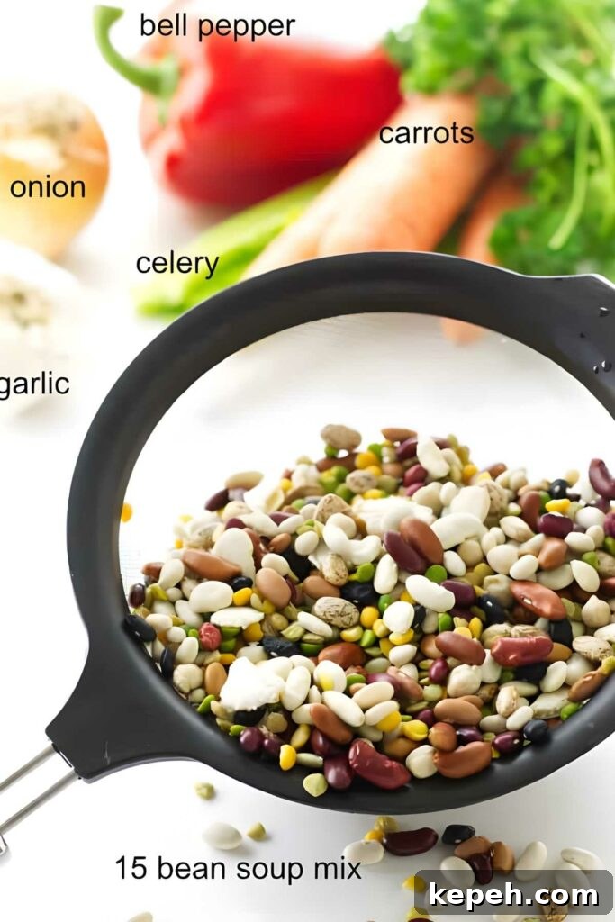 15-Bean Soup Recipe: Hearty, Protein-Packed Comfort Stew 3 Strainer with colorful 15 bean soup mix and assorted labeled vegetables.