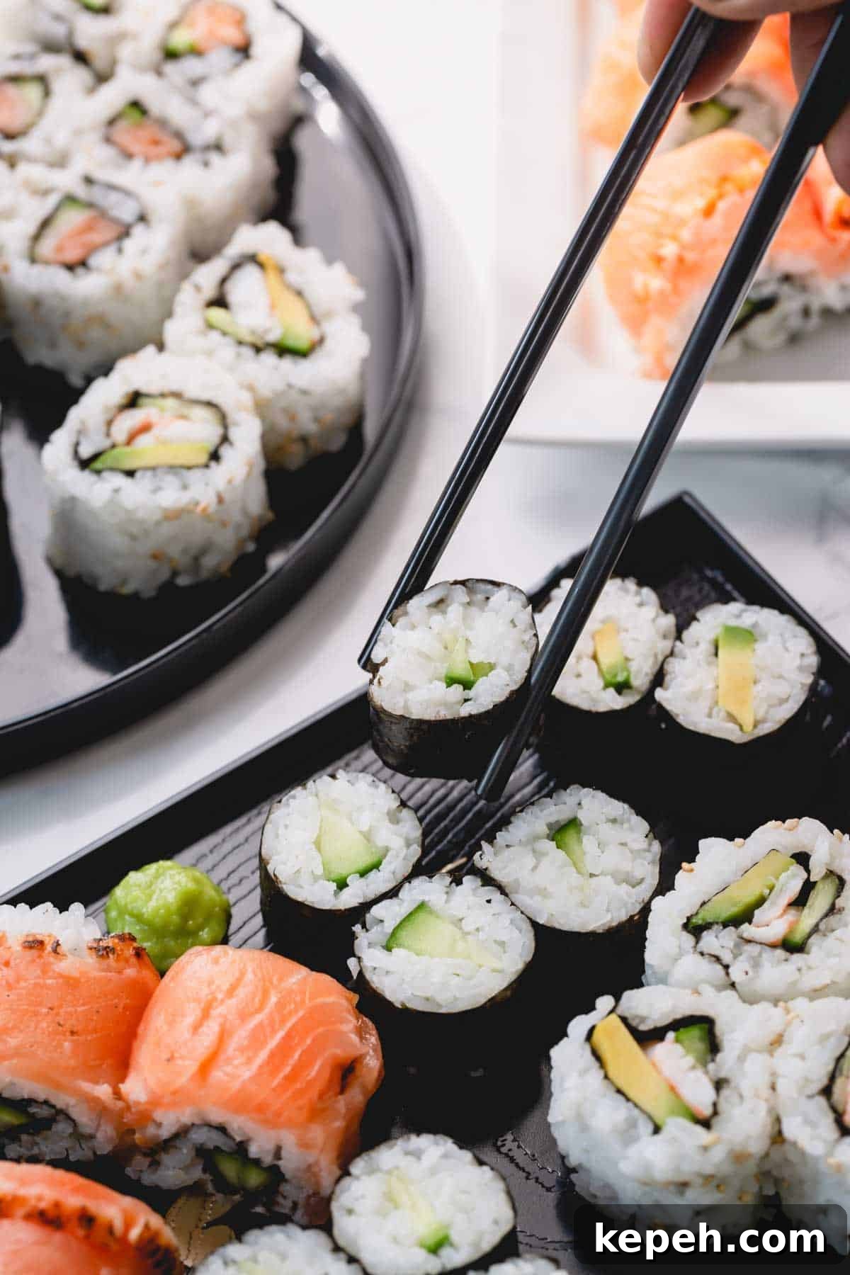 Homemade Sushi Roll Recipe: Step-by-Step Guide for Perfect Rolls 3 Cucumber rolls with one piece picked up with chopsticks.