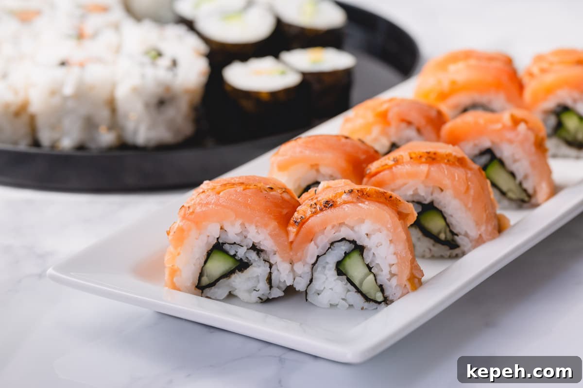 Homemade Sushi Roll Recipe: Step-by-Step Guide for Perfect Rolls 8 Smoked salmon covered cucumber rolls on a white plate.