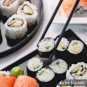 Homemade Sushi Roll Recipe: Step-by-Step Guide for Perfect Rolls 9 Cucumber rolls with one piece picked up with chopsticks.
