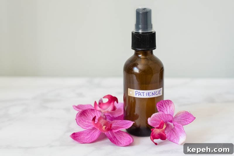 Renewed Patience: DIY Calming Essential Oil Blend for Moms 9 Dark glass spray bottle of homemade calming essential oil blend.