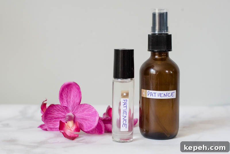 Renewed Patience: DIY Calming Essential Oil Blend for Moms 3 A glass spray bottle and roller bottle filled with DIY essential oil blend for moms.