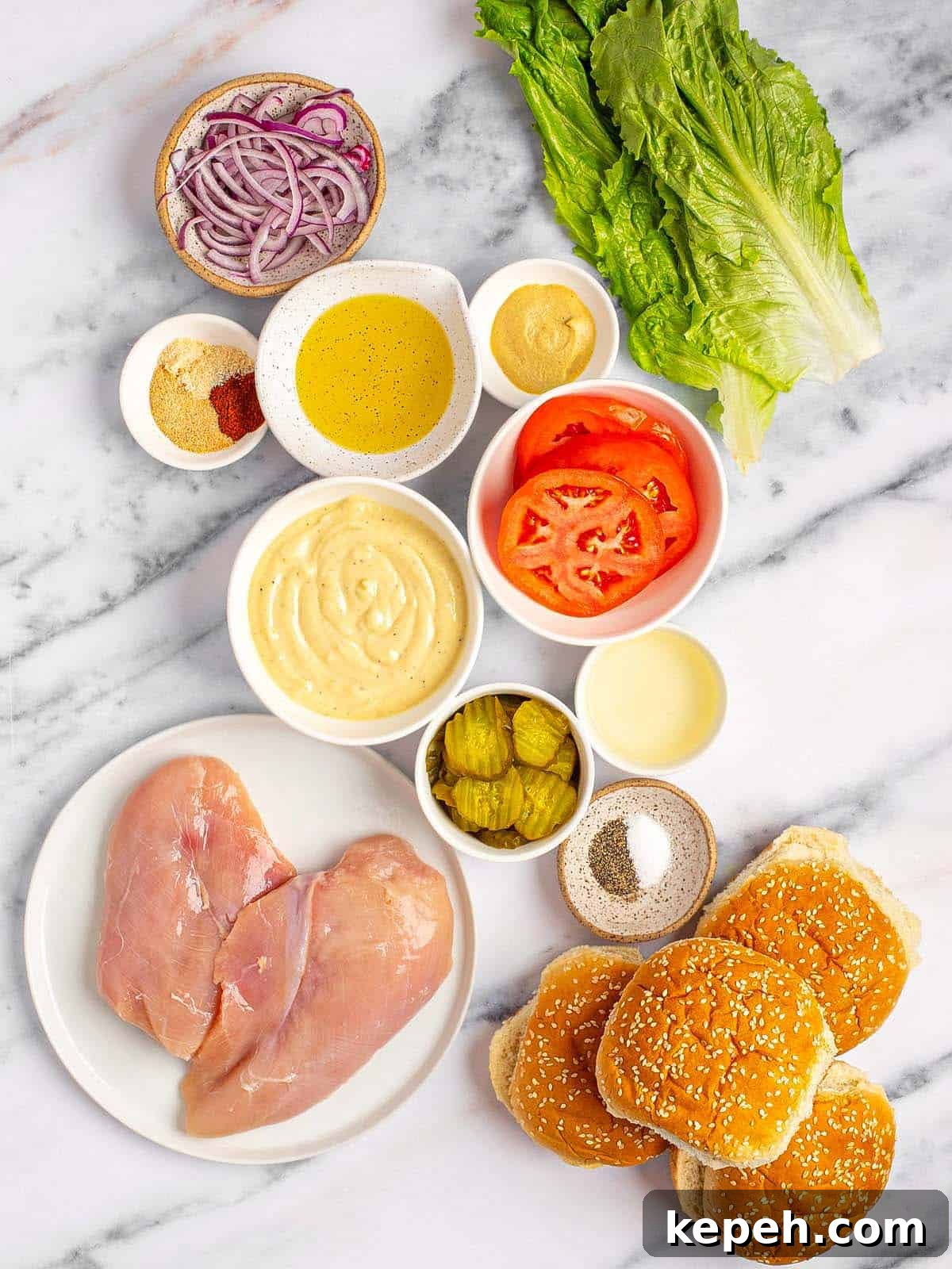 Bowls of ingredients to make grilled chicken sandwiches.