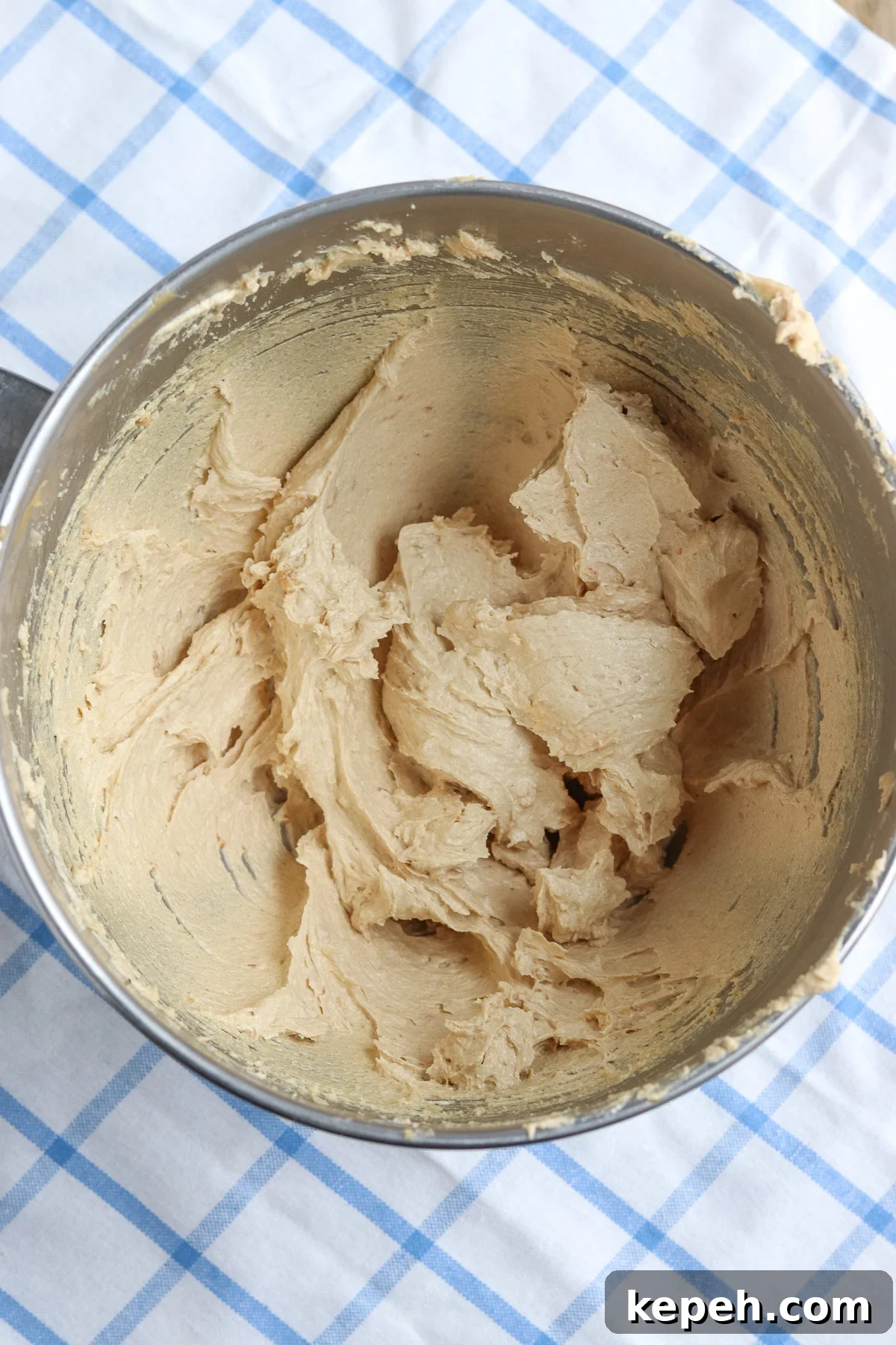 stand mixer bowl showing creamed butters and sugars