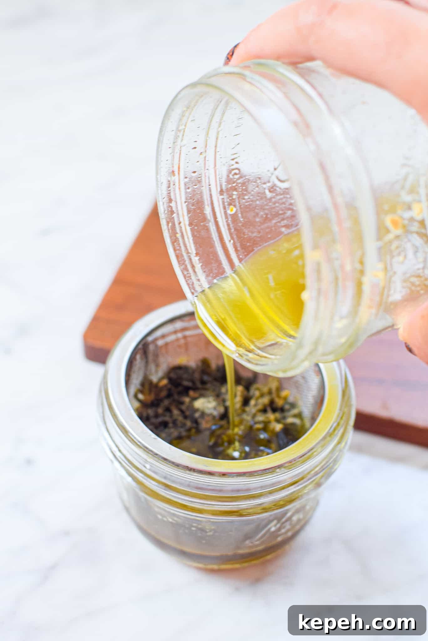 Boost Cannabutter Potency: Tips to Strengthen and Activate It 2 A picture of cannabutter being poured into a mason jar.