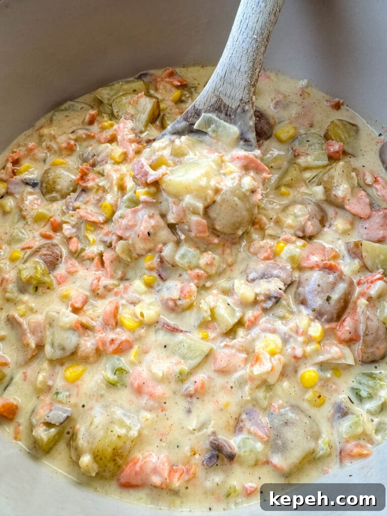 Creamy Salmon and Sweet Corn Chowder Recipe 10 creamy salmon chowder with corn and potatoes in a Dutch oven