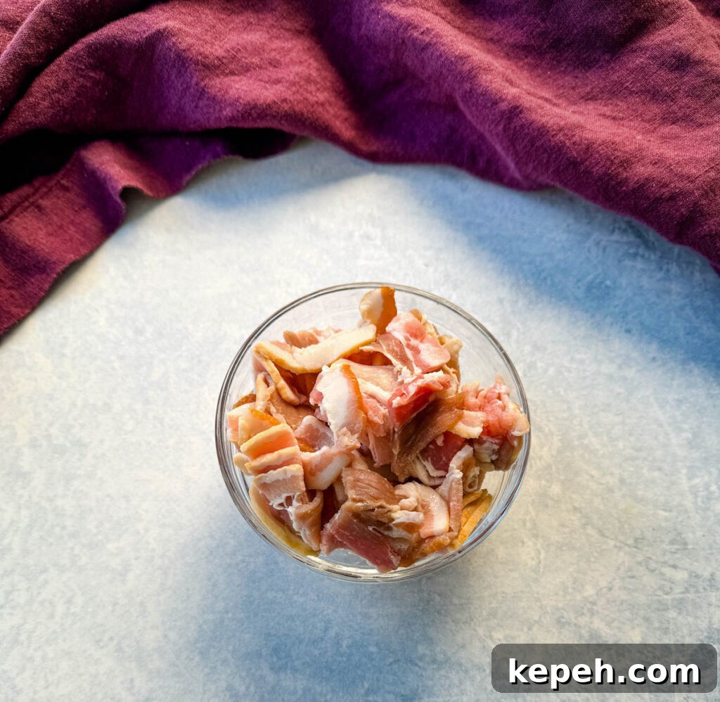 Creamy Salmon and Sweet Corn Chowder Recipe 4 uncooked bacon in a glass bowl