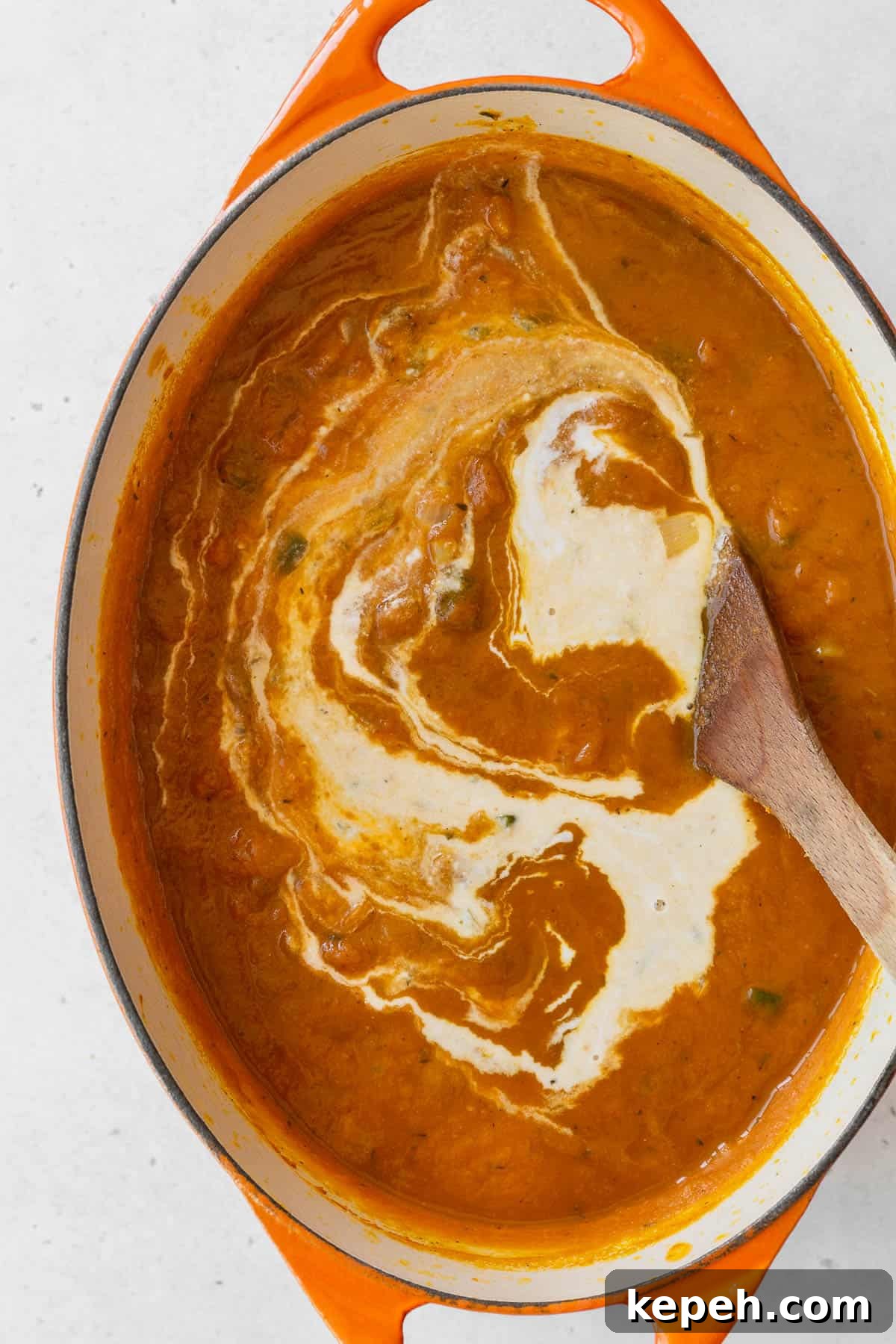 Creamy Plant-Based Pumpkin Soup Recipe for Fall Comfort 8 Coconut milk added to the pot with the rest of the vegan pumpkin soup ingredients.