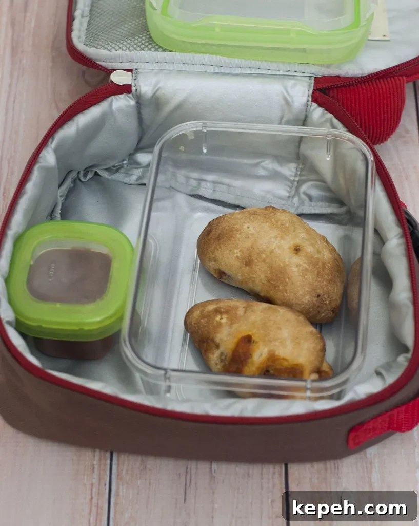 Mini Pepperoni Calzone Recipe: Crispy, Cheesy Hand Pies 4 You'll be parent of the year when you send your kids back to school with mini pepperoni calzones. They're easy to make in bulk and freeze. #SundaySupper TheRedheadBaker.com