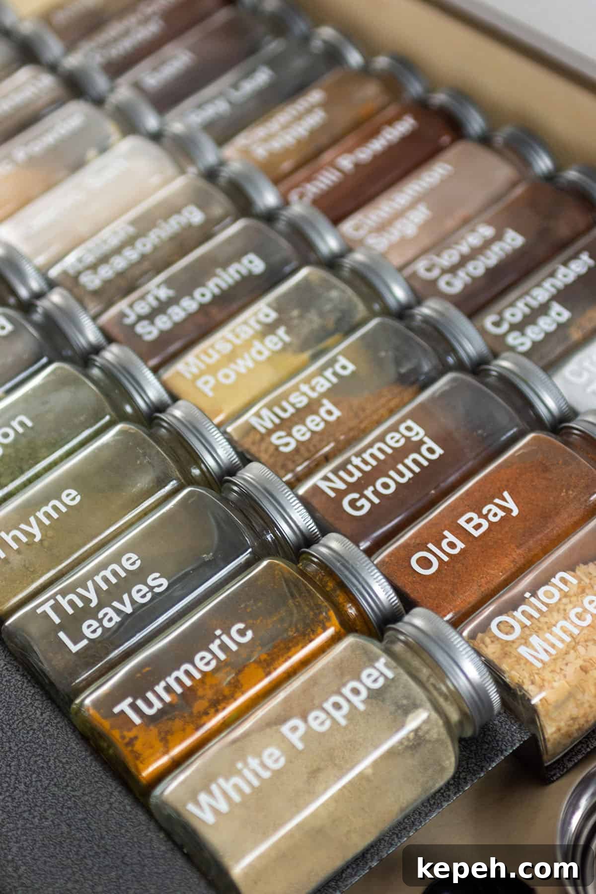 Spice Drawer Organizer: Quick Access and Neat Spice Storage 3 Spice jars with white labels.