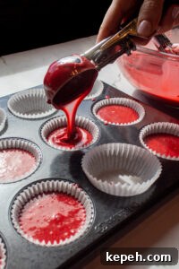Decadent Red Velvet Cupcakes Recipe for Perfect Moist Cakes 9 pouring red velvet cupcake batter