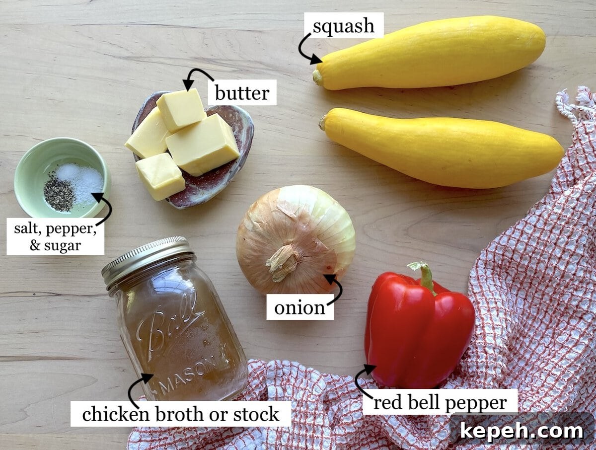 The ingredients in buttery yellow squash with onions, laid out & labeled.