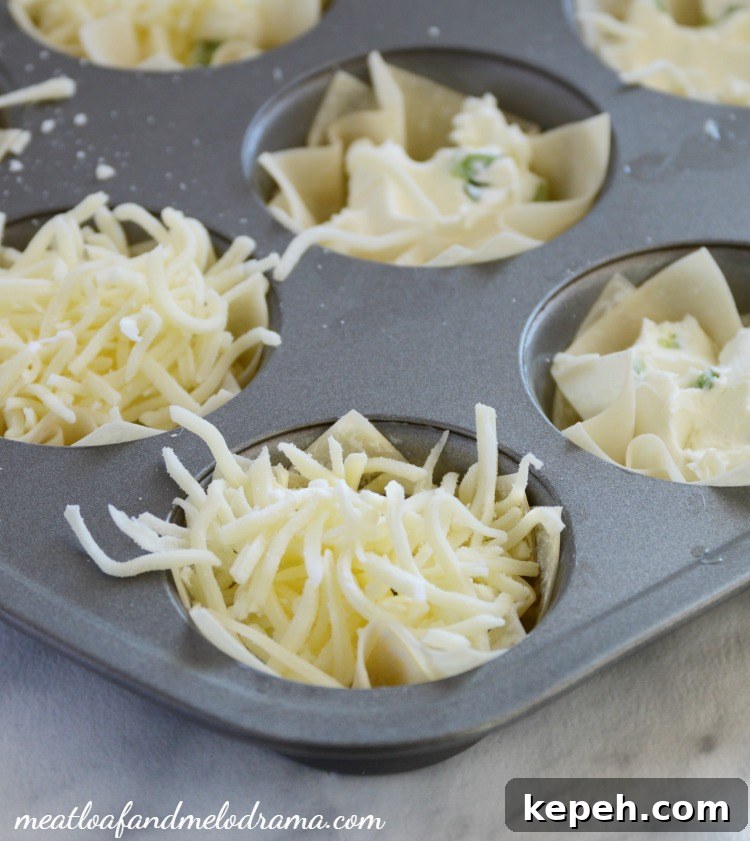 Bacon Jalapeño Popper Wonton Cups — Crispy Bite-Sized Appetizers 4 wonton wrappers with mozzarella cheese in muffin tin