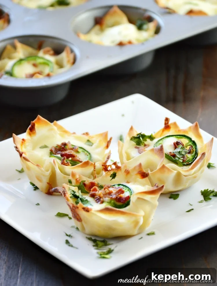 Bacon Jalapeño Popper Wonton Cups — Crispy Bite-Sized Appetizers 8 wonton cups on a square plate