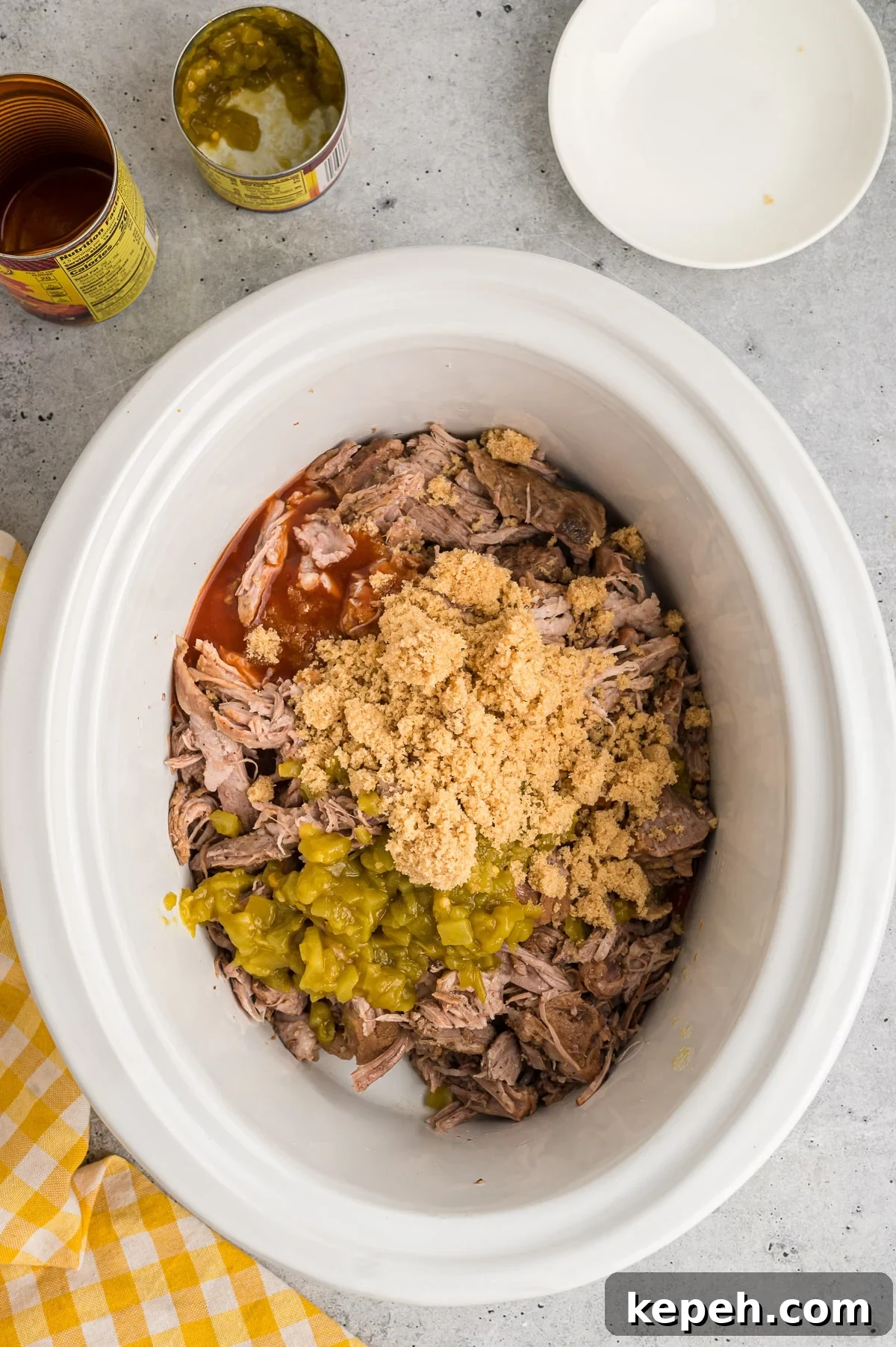 Cafe Rio Sweet Pork Recipe: Copycat Carnitas with Tangy Sauce 5 Shreded pork with brown sugar and green chiles.