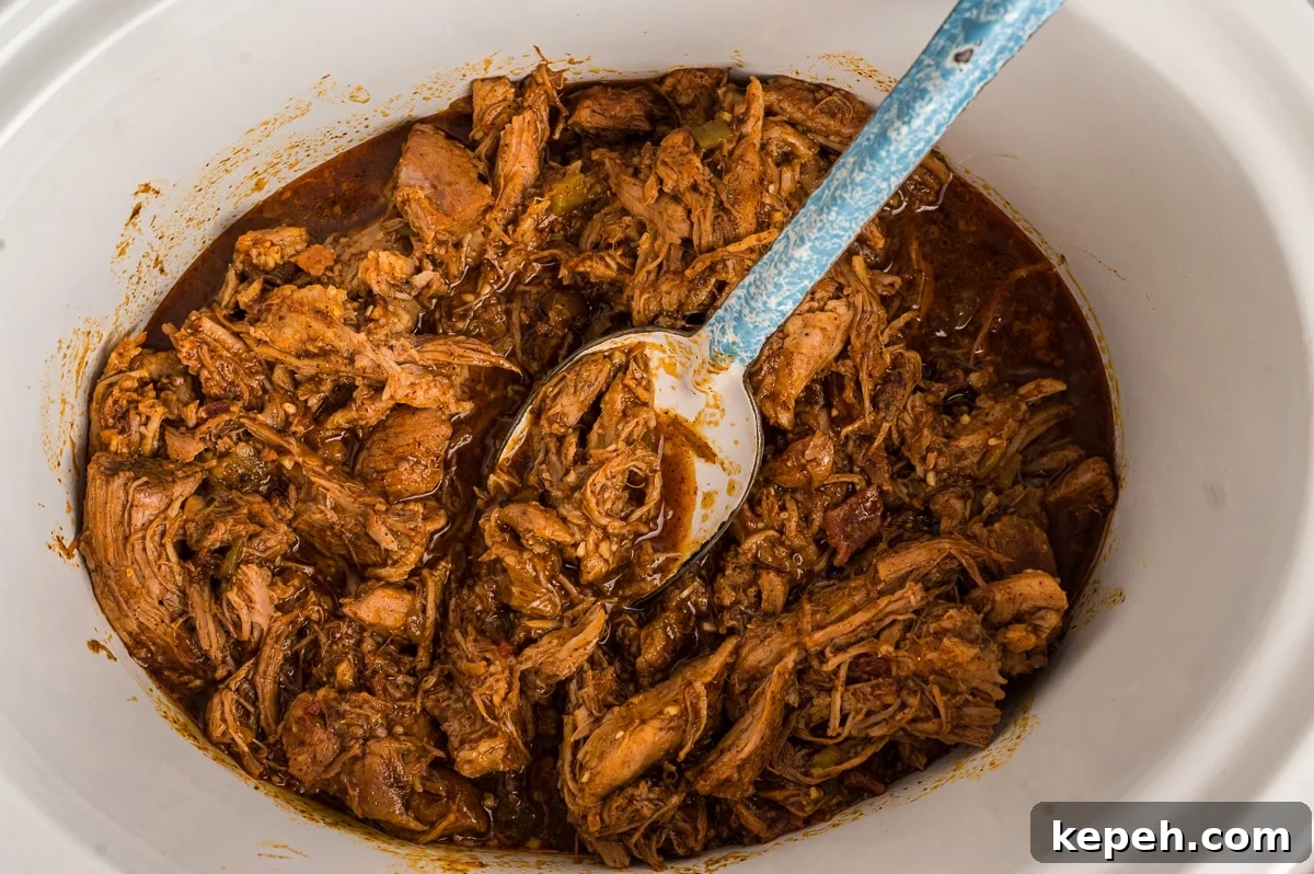 Cafe Rio Sweet Pork Recipe: Copycat Carnitas with Tangy Sauce 7 cafe rio pork shredded in a crockpot.