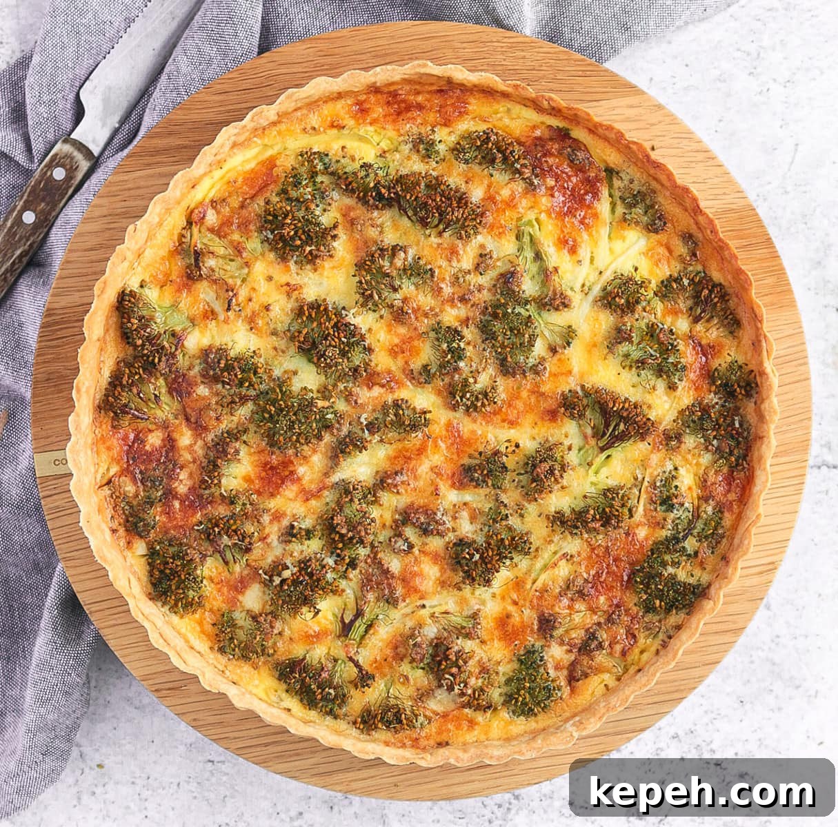 Broccoli Quiche from above on a wooden board