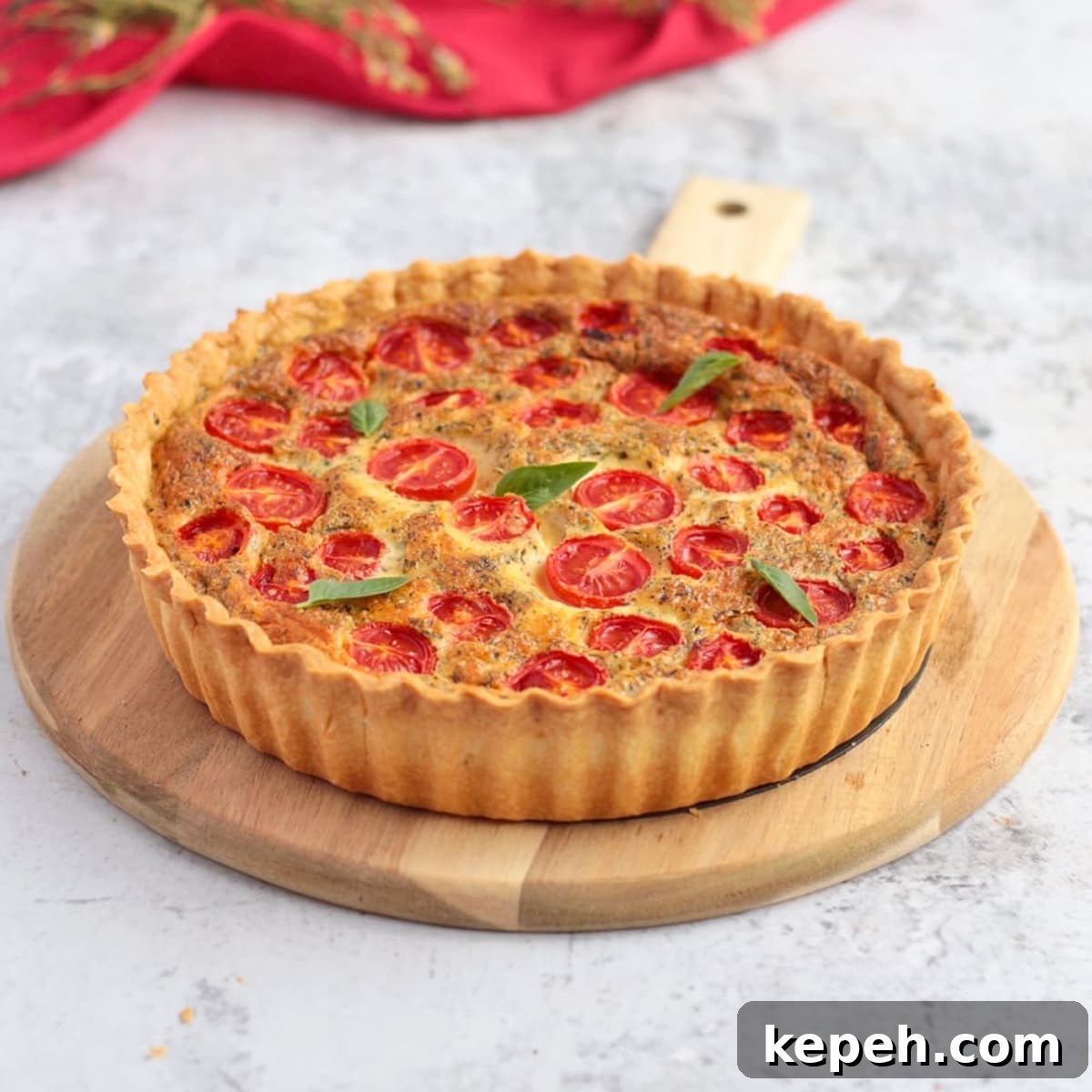Cheese Quiche with Tomato on a serving board