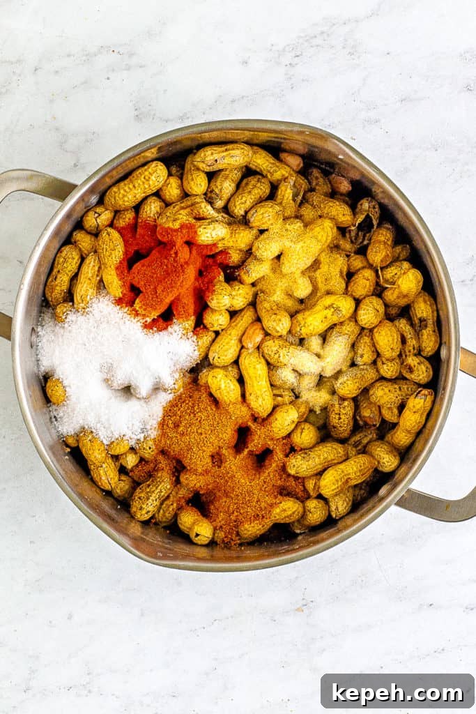 Cajun-Style Boiled Peanuts: Spicy Southern Snack Recipe 4 Seasonings and peanuts in a pan.