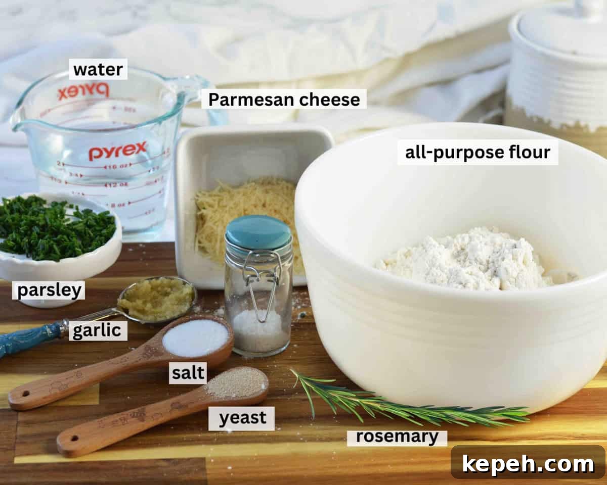 Savory Herb and Cheese Loaf Recipe for Homemade Bread 3 Ingredients laid out on cutting board to make herb artisan bread recipe.