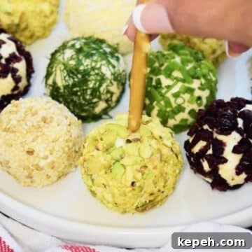 Mini pretzel stick being pushed into savory balls. 