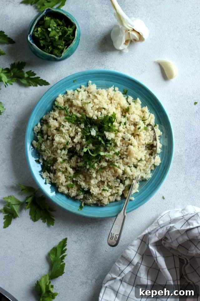 Cauliflower Rice: How to Make It + 16 Delicious Recipes 24 Rice on a Blue Plate with Parsley and Garlic