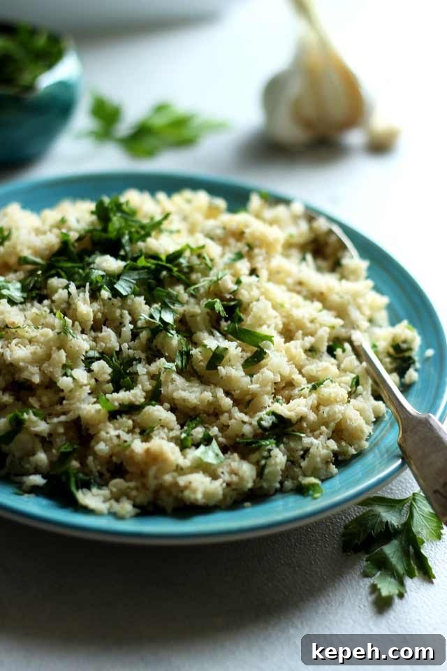 Cauliflower Rice: How to Make It + 16 Delicious Recipes 4 Rice on a Blue Plate with a Fork