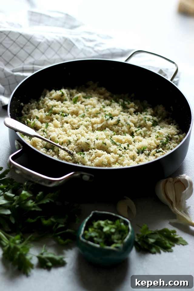 Cauliflower Rice: How to Make It + 16 Delicious Recipes 5 Rice in a Skillet with Garlic and Parsley Next to It