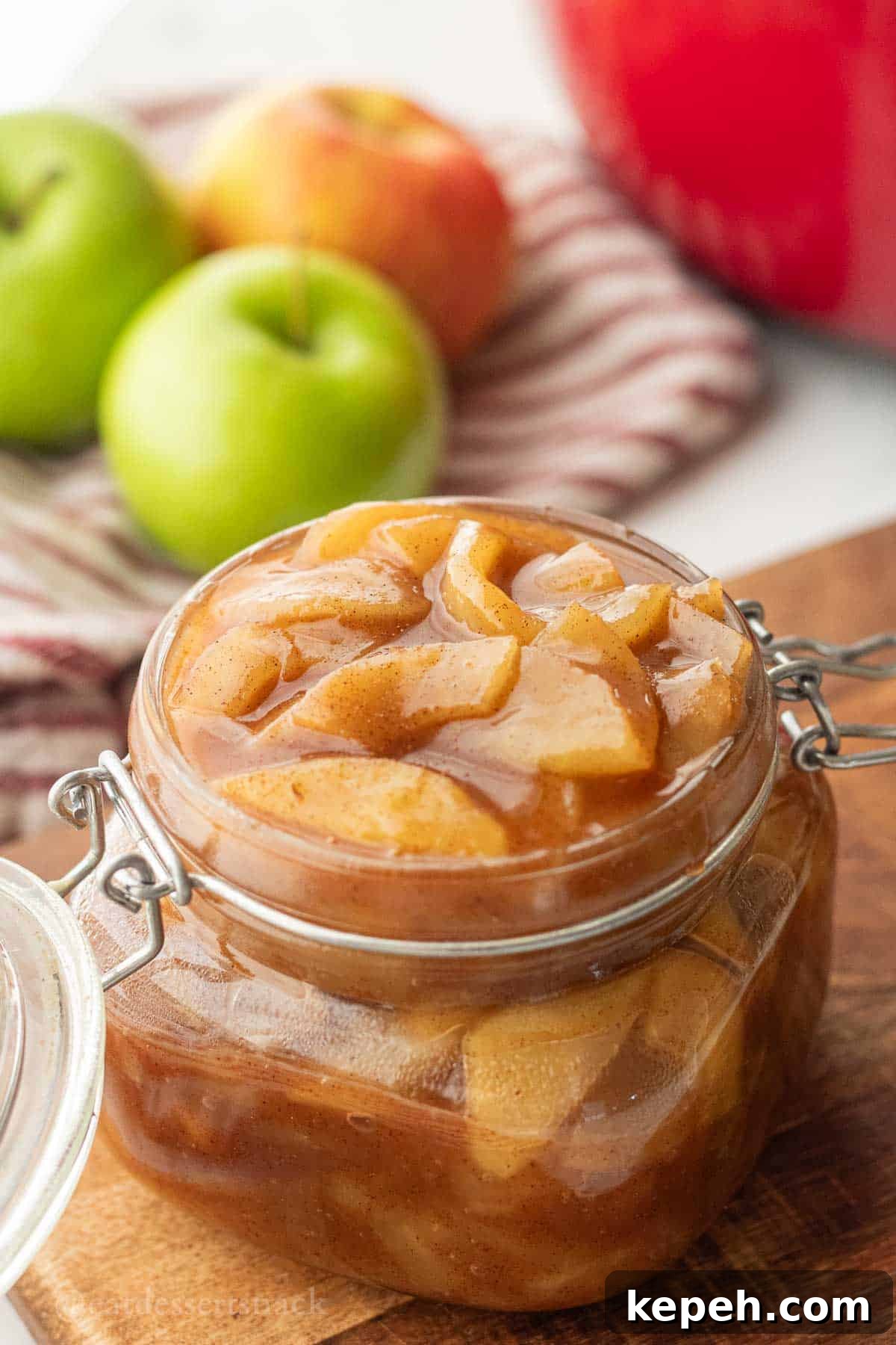 Homemade Apple Pie Filling Recipe for Perfect Rustic Pies 2 Cooked apple pie filling in glass jar.