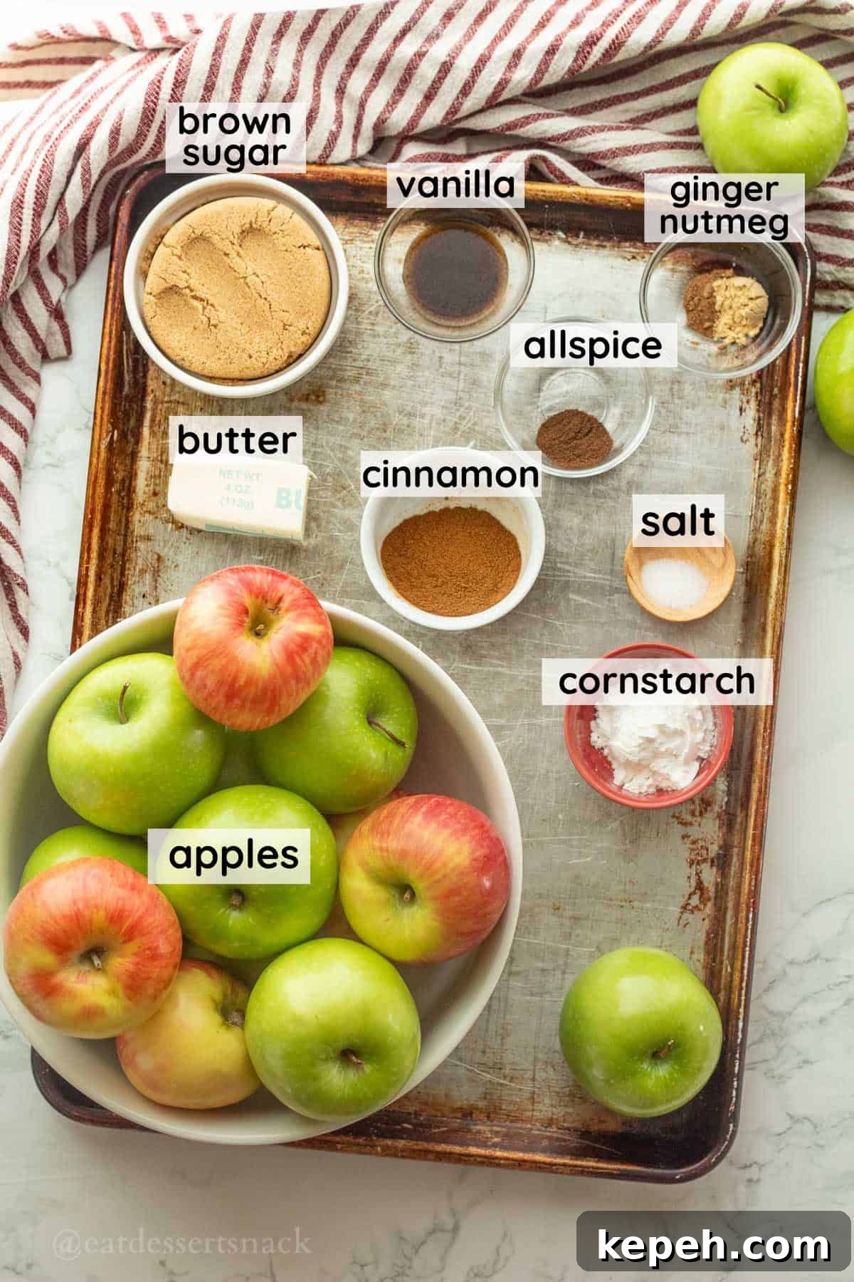 Homemade Apple Pie Filling Recipe for Perfect Rustic Pies 3 Labeled ingredients for homemade apple pie in glass bowls on metal baking sheet.