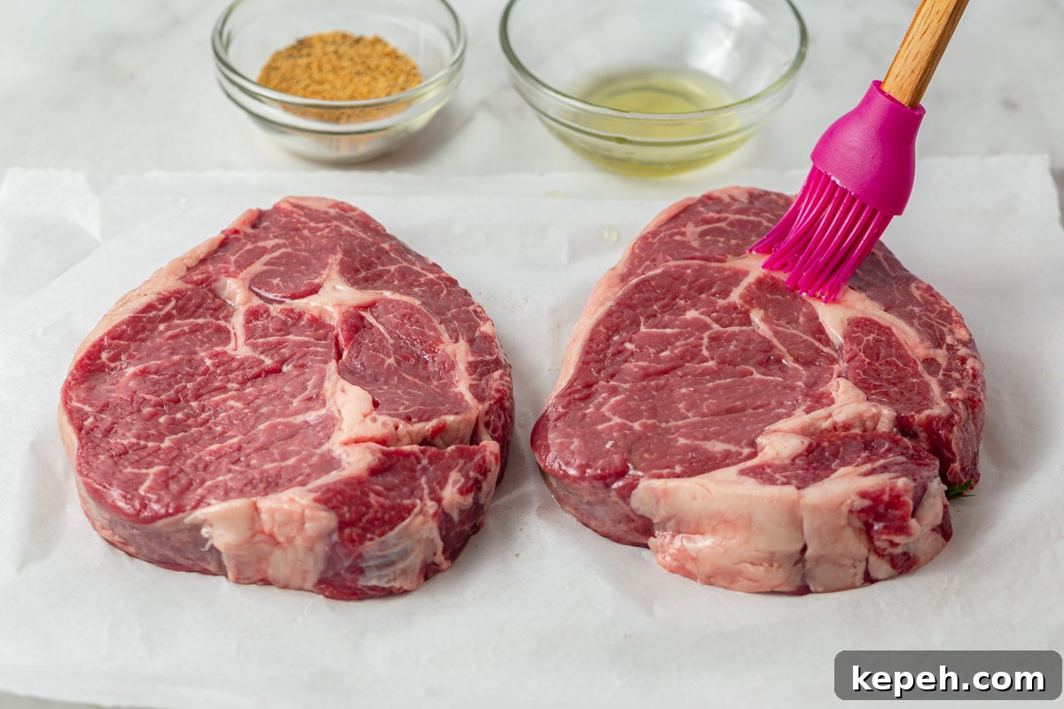 Perfect Ribeye Steak in the Air Fryer: Juicy, Quick Method 4 brushing oil on the steak.