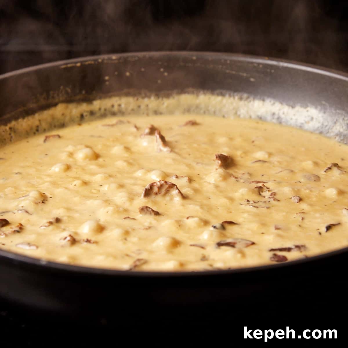 Photo showing vegan mushroom cream sauce in the frying pan.