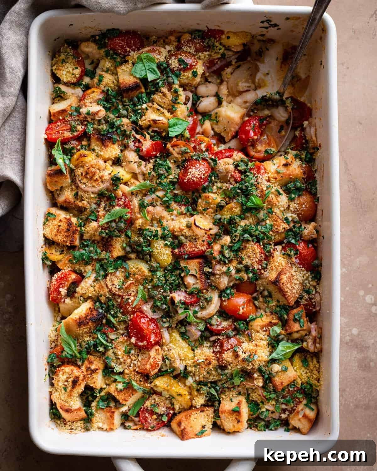 tomato and white bean casserole with spoon dug in