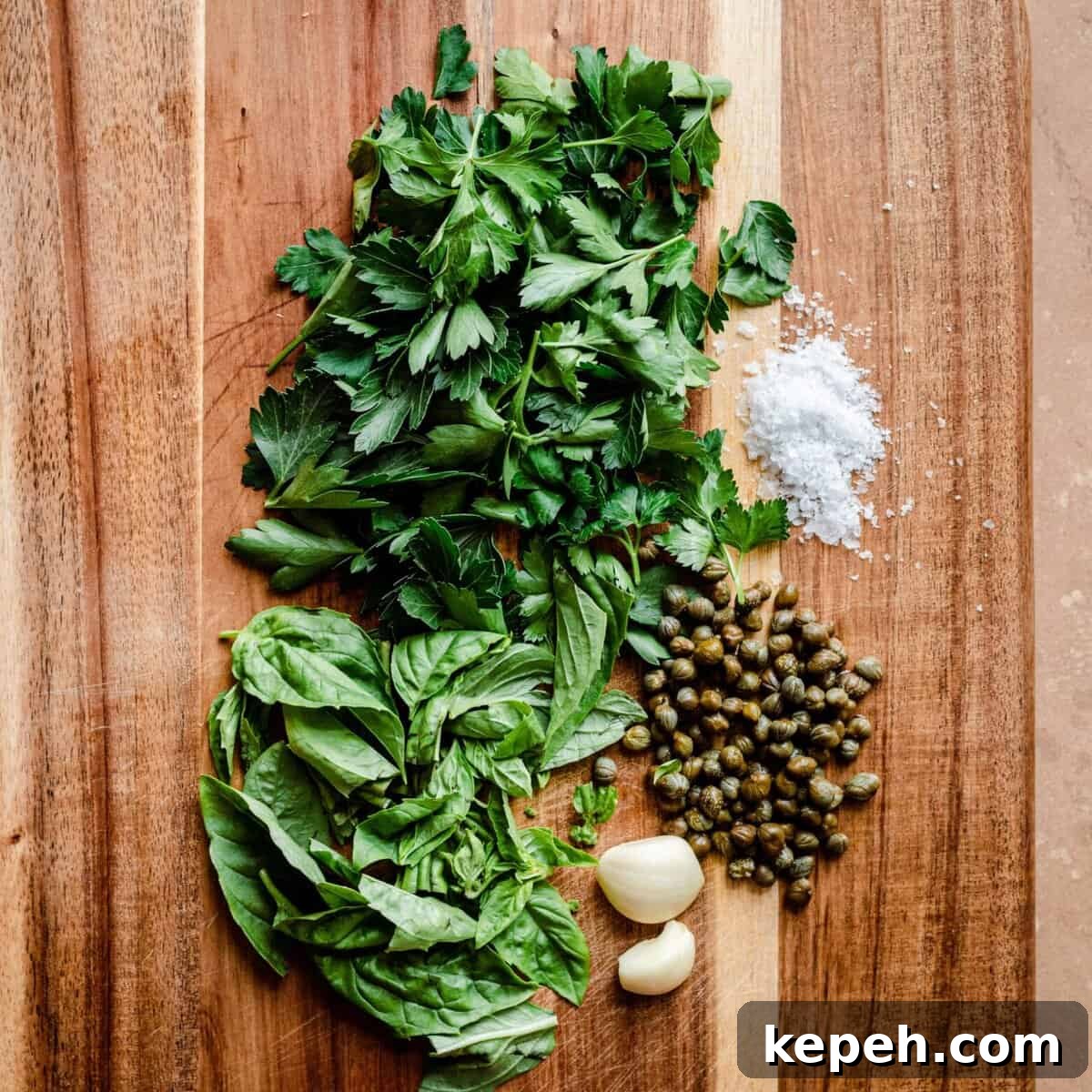 parsley basil capers garlic salt on cutting board for gremolata.