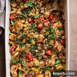 tomato and white bean casserole with spoon dug in