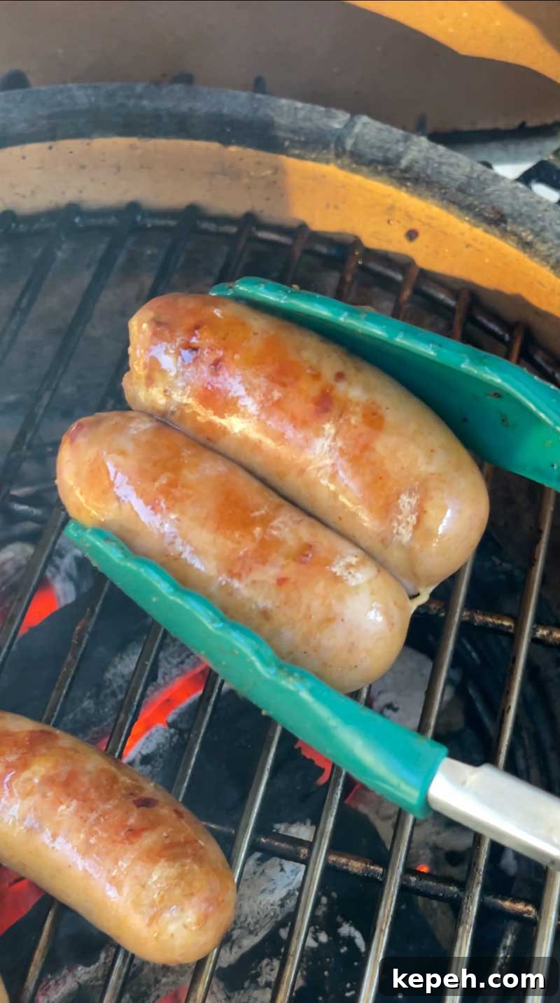 Sausages browning on the grill