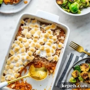 Sweet potato casserole with streusel topping in a white casserole dish
