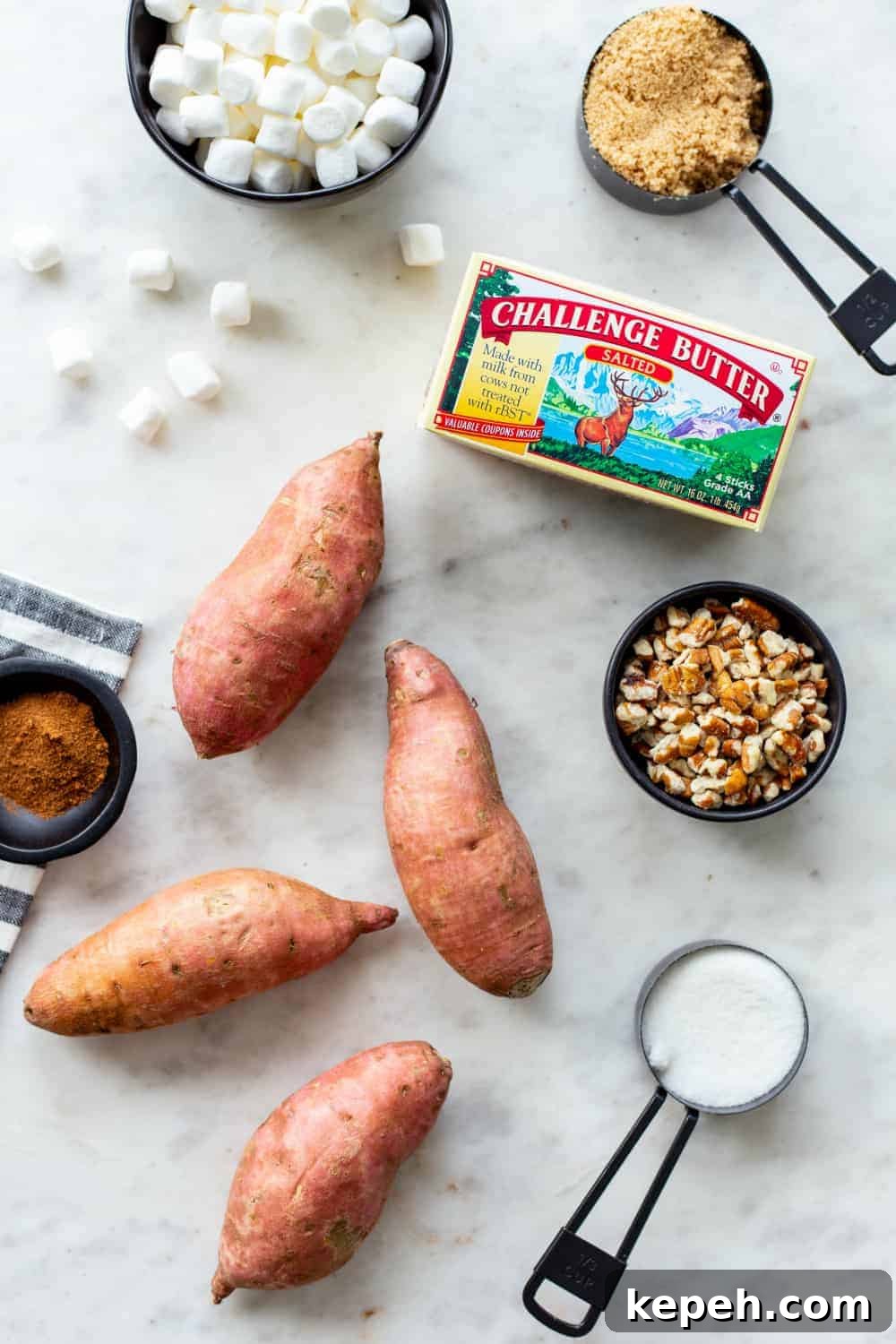 Ingredients for sweet potato casserole on a marble countertop