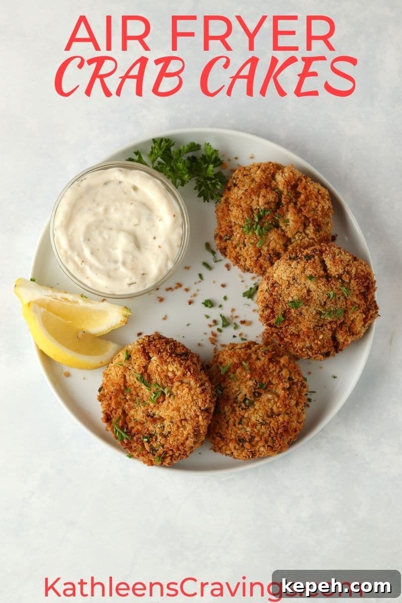 Crispy Air Fryer Crab Cakes Recipe for Golden, Juicy Results 2 crab cakes with tartar sauce
