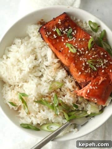 Air Fryer Honey Garlic Salmon filet over rice.