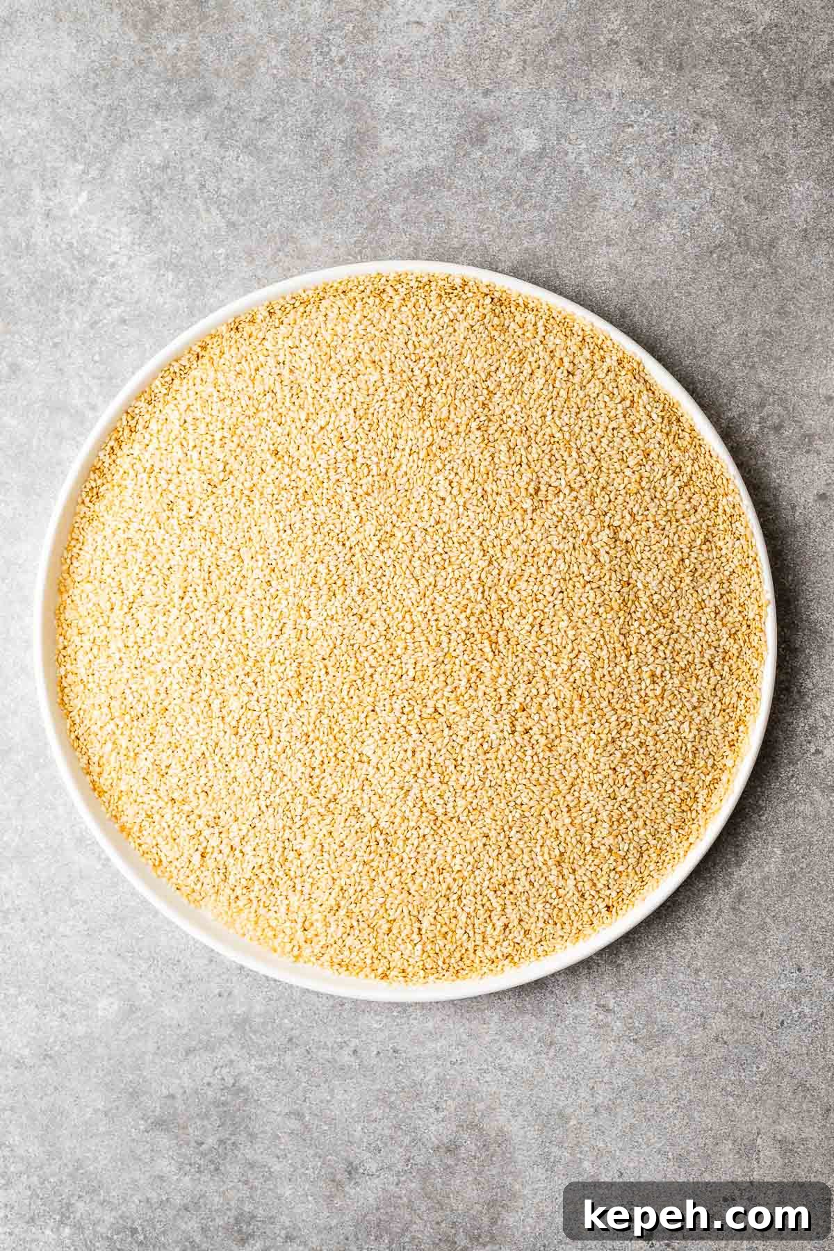 How to Toast Sesame Seeds on the Stove or in the Oven 6 A large plate with oven-roasted sesame seeds.