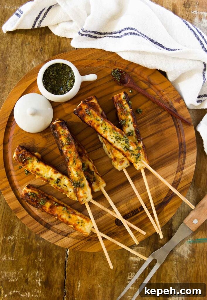 Queijo Coalho Skewers: Complete Guide to Grilling Brazilian Cheese 2 a wooden platter of grilling cheese on skewers with a chimichurri and a white linen