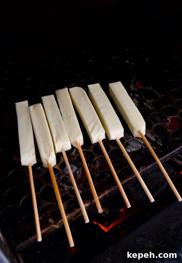 Queijo Coalho Skewers: Complete Guide to Grilling Brazilian Cheese 4 skewered cheese on a hot grill