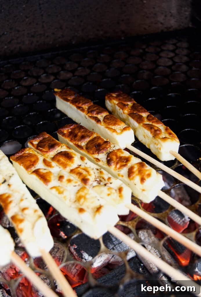 Queijo Coalho Skewers: Complete Guide to Grilling Brazilian Cheese 5 golden brown queijo coalho on skewers on grill grates