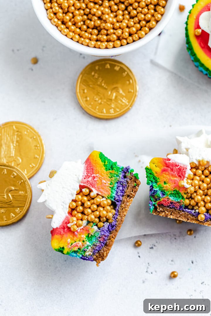 Mini Rainbow Cheesecakes with Pot of Gold Surprise 5 two halves of a cheesecake cupcake with gold sprinkles in middle