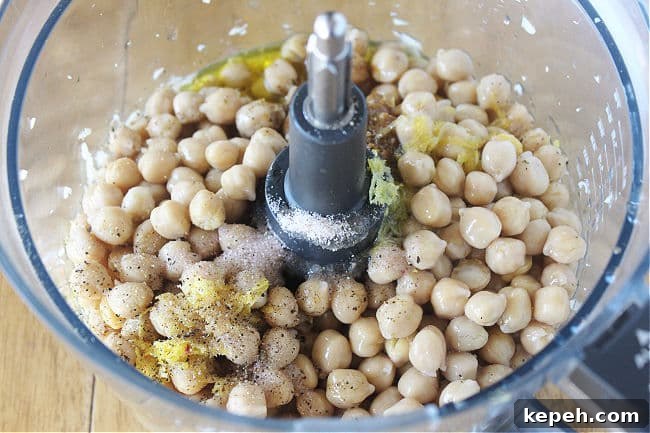 Chickpeas, lemon zest, and olive oil in a food processor.