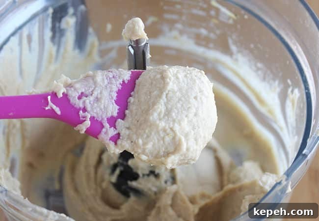 Blended hummus in a food processor.