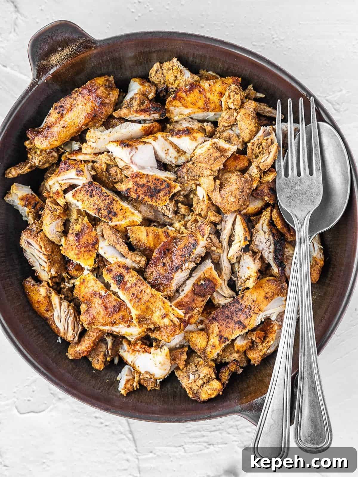 Lebanese Chicken Shawarma Recipe: Wraps or Bowls Made at Home 9 Bowl with sliced chicken shawarma pieces.