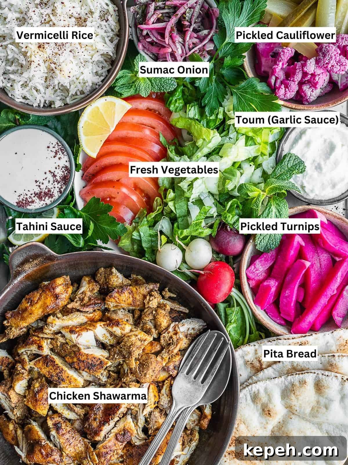 Lebanese Chicken Shawarma Recipe: Wraps or Bowls Made at Home 10 Chicken shawarma platter with all the sides and toppings.